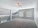 Open loft with two windows and carpeting provides additional living space at 4583 Barnacle Dr, Port Orange, FL 32127