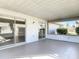 Outdoor patio with tile flooring and screen panels at 4583 Barnacle Dr, Port Orange, FL 32127