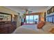 Inviting main bedroom featuring a balcony with ocean views and stylish furnishings at 4651 S Atlantic Ave # 604, Ponce Inlet, FL 32127