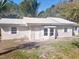 Charming single-story home with a metal roof and a bay window at 4700 Se 160Th Ct, Ocklawaha, FL 32179