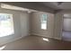 Bright living room with neutral paint, ceiling fan, and natural light from the windows at 4700 Se 160Th Ct, Ocklawaha, FL 32179