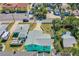 Birds eye view of a beautiful home with a long driveway, well-kept lawn, and mature trees at 519 Mobile Ave, Daytona Beach, FL 32118