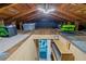 Spacious attic with wooden beams and storage space at 519 Mobile Ave, Daytona Beach, FL 32118
