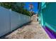 Backyard with a white fence, an outdoor storage shed, and ample space at 519 Mobile Ave, Daytona Beach, FL 32118
