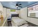 Cozy bedroom with ceiling fan, window, and natural light at 519 Mobile Ave, Daytona Beach, FL 32118