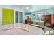 Bright and airy bedroom featuring large windows, ceiling fan and view of the outdoors at 519 Mobile Ave, Daytona Beach, FL 32118