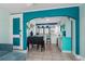 Open-concept dining area adjacent to the kitchen, featuring tile floors, and turquoise accents at 519 Mobile Ave, Daytona Beach, FL 32118
