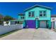 Beautiful two-story home with beach charm, garage, and colorful lattice at 519 Mobile Ave, Daytona Beach, FL 32118