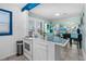 Open kitchen featuring modern appliances, bright accents, and seamlessly flows into the living area at 519 Mobile Ave, Daytona Beach, FL 32118