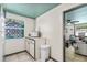 Small kitchenette area with microwave and view into a living room at 519 Mobile Ave, Daytona Beach, FL 32118