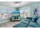 Cozy living room featuring tile floors, sectional sofa and multiple windows for lots of natural light at 519 Mobile Ave, Daytona Beach, FL 32118