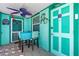 Quaint patio space with dining set, colorful decor, and stylish flooring at 519 Mobile Ave, Daytona Beach, FL 32118