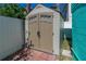 Outdoor storage shed with double doors, offering secure storage in the backyard at 519 Mobile Ave, Daytona Beach, FL 32118