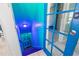 Brightly lit stairwell with painted steps leads down to a locked door at 519 Mobile Ave, Daytona Beach, FL 32118