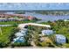 Scenic aerial shot highlighting the property, surrounding homes, and waterfront at 520 S Peninsula Ave # 2C7, New Smyrna Beach, FL 32169