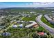 Wide aerial shot of the condo, swimming pool, boat docks, and surrounding neighborhood at 520 S Peninsula Ave # 2C7, New Smyrna Beach, FL 32169