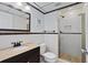 Well-lit bathroom with a stylish vanity, tiled shower, and a modern, attractive design at 520 S Peninsula Ave # 2C7, New Smyrna Beach, FL 32169