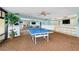 Well-equipped game room featuring a ping pong table, bar area, and ample space for entertainment at 520 S Peninsula Ave # 2C7, New Smyrna Beach, FL 32169
