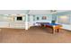 Community game room with a pool table, ping pong, bar, and seating, creating a fun and social atmosphere at 520 S Peninsula Ave # 2C7, New Smyrna Beach, FL 32169