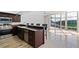 Modern kitchen with stainless steel appliances and a beautiful view at 520 S Peninsula Ave # 2C7, New Smyrna Beach, FL 32169