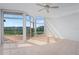 Bright room with floor to ceiling windows, showing off beautiful view at 520 S Peninsula Ave # 2C7, New Smyrna Beach, FL 32169