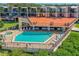 Community pool deck offers lounge seating, shade umbrellas and a spa at 520 S Peninsula Ave # 2C7, New Smyrna Beach, FL 32169