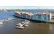 Stunning aerial view of waterfront property with boat docks and a view of the city skyline at 533 Marina Point Dr # 533, Daytona Beach, FL 32114