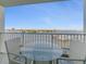 Enjoy beautiful water views from this spacious balcony with a table and two chairs, perfect for relaxing and entertaining at 533 Marina Point Dr # 533, Daytona Beach, FL 32114