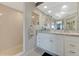 Bathroom featuring a tiled shower, large vanity, and tile floors at 533 Marina Point Dr # 533, Daytona Beach, FL 32114