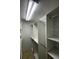 Organized walk-in closet featuring built-in shelves and ample storage space for an efficient storage solution at 533 Marina Point Dr # 533, Daytona Beach, FL 32114