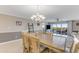 Open-concept dining area with seating for six and access to the balcony and views at 533 Marina Point Dr # 533, Daytona Beach, FL 32114