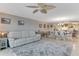 Open-concept living room with slider doors to the balcony and open flow to the dining area at 533 Marina Point Dr # 533, Daytona Beach, FL 32114