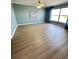 Bright living room with laminate flooring, large window, and neutral paint, creating an inviting atmosphere at 533 Marina Point Dr # 533, Daytona Beach, FL 32114