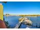 Beautiful water view with dock, boats, and city view in the distance on a clear, sunny day at 533 Marina Point Dr # 533, Daytona Beach, FL 32114