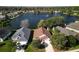 Aerial view of the homes near a tranquil lake and well-maintained landscaping at 549 Coral Trace Blvd, Edgewater, FL 32132