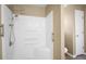 This bathroom includes a shower with a detachable head and built-in shelves at 549 Coral Trace Blvd, Edgewater, FL 32132