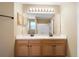 Bathroom featuring double sinks, modern fixtures, and a well-lit mirror at 549 Coral Trace Blvd, Edgewater, FL 32132