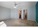 This bedroom offers neutral walls, carpet flooring, and entry to the hallway at 549 Coral Trace Blvd, Edgewater, FL 32132