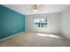 Bedroom featuring a serene lake view from the window and plush carpet at 549 Coral Trace Blvd, Edgewater, FL 32132