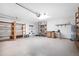 This garage features storage shelves, speckled flooring, and overhead lighting at 549 Coral Trace Blvd, Edgewater, FL 32132