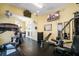 View of the community gym with weights, treadmills, ellipticals and a flat screen TV at 549 Coral Trace Blvd, Edgewater, FL 32132