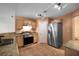 Kitchen featuring granite countertops, stainless steel appliances, pantry, and tile floors at 549 Coral Trace Blvd, Edgewater, FL 32132