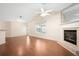 Spacious living room featuring fireplace, fan and access to backyard at 549 Coral Trace Blvd, Edgewater, FL 32132