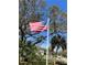 An American flag flies proudly in the yard of this home, adding a patriotic touch at 630 Yupon Ave, New Smyrna Beach, FL 32169