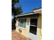 Exterior view showing window, door, and the roof at 630 Yupon Ave, New Smyrna Beach, FL 32169