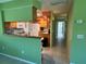 Open-concept layout with a view into the kitchen and hallway at 630 Yupon Ave, New Smyrna Beach, FL 32169