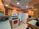 Bright kitchen with tile flooring, plenty of storage, and modern appliances at 630 Yupon Ave, New Smyrna Beach, FL 32169