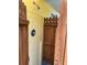 This home's outdoor shower features a wooden privacy fence, yellow brick walls, and updated shower head at 630 Yupon Ave, New Smyrna Beach, FL 32169