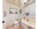 Clean half-bathroom with a modern vanity and a decorative painting at 6665 Merryvale Ln, Port Orange, FL 32128