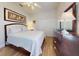 Cozy bedroom with ceiling fan, dark wood furniture, and neutral walls, creating a relaxing and comfortable atmosphere at 6665 Merryvale Ln, Port Orange, FL 32128